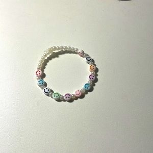 A handmade smiley face bracelet !<3